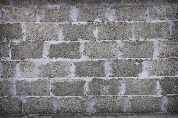 暗い灰色の石のレンガの壁の背景 — ストック写真