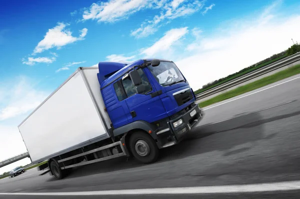 Boxed Truck Driving Fast Countryside Road Green Trees Bushes Blue Stock Image