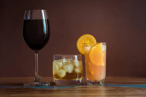 Alcohol drinks on dark solid background