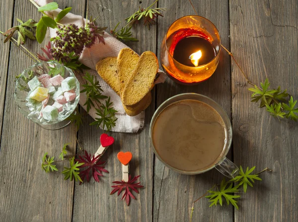 Coffee with candle ,rusk and sweets — Stock Photo, Image