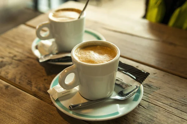 Coffee in a white cups — Free Stock Photo