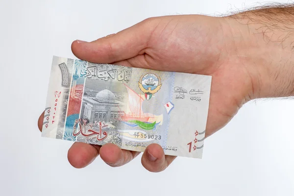 Kuwaitiska dinar sedel i handen. — Stockfoto