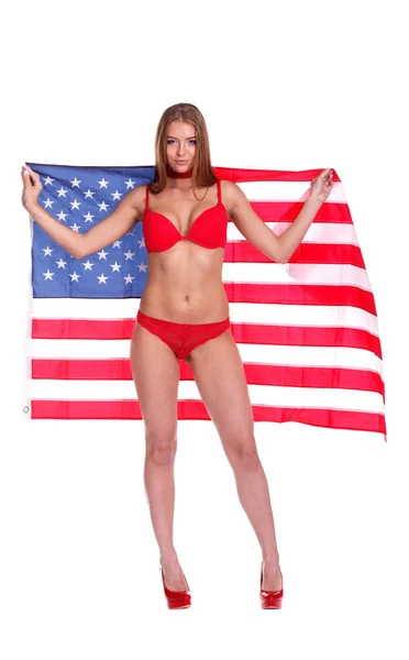 Bandeira dos Estados Unidos da América em mãos de mulher bonita. É — Fotografia de Stock