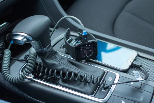 Modern car interior with smart watch on gear stick. — Stock Photo, Image