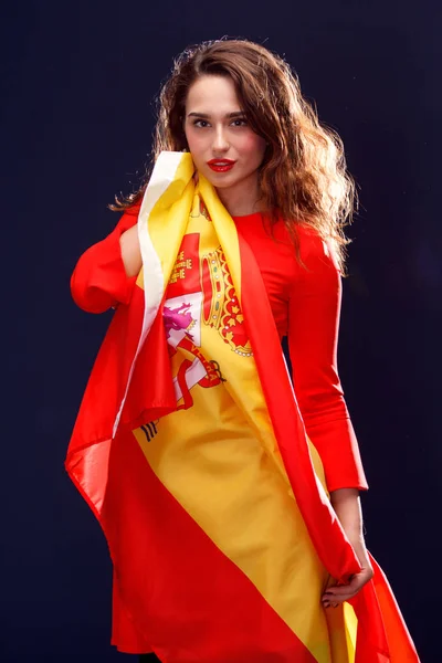 Flag of Spain in hands of beautiful woman. — Stock Photo, Image