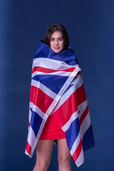 Beautiful girl with the flag of Britain — Stock Photo, Image