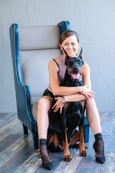 Interior with woman and dog — Stock Photo, Image