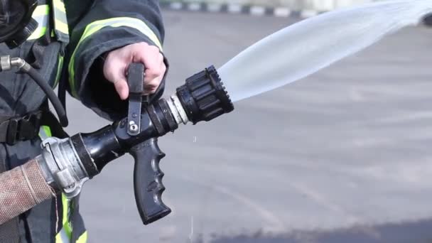 Water extinguisher in hands, close up view. — Stock Video