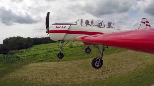Pilot Performs aerobatics figures with passenger in small Yakovlev 52. — Stock Video