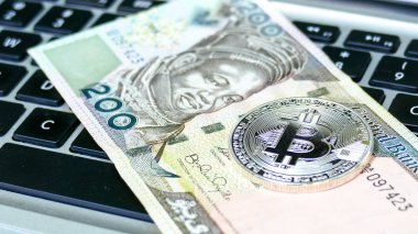 Bitcoin on naira bills.  clipart