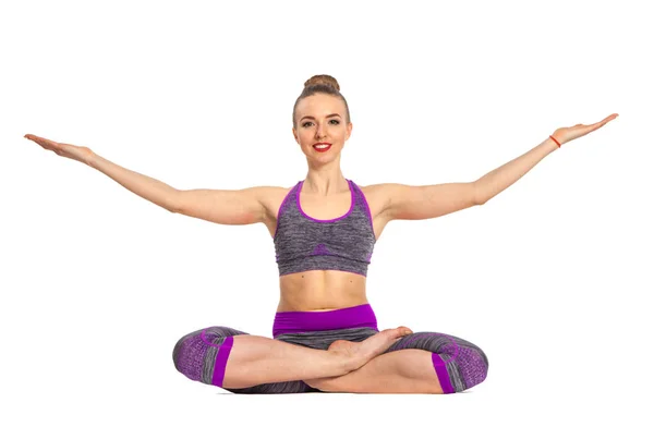 Women who do yoga perform sitting on the floor. Lotus pose. — Stock Photo, Image