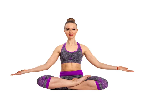 Women who do yoga perform sitting on the floor. Lotus pose. — Stock Photo, Image