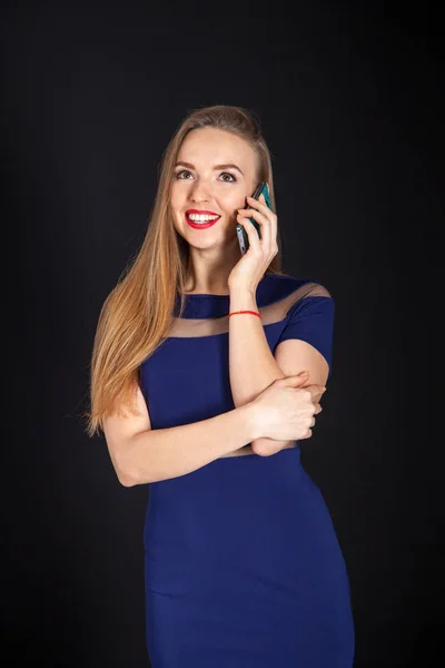 Photo shoot beautiful blonde woman in navy blue dress — Stock Photo, Image