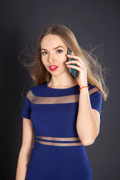 Photo shoot beautiful blonde woman in navy blue dress — Stock Photo, Image