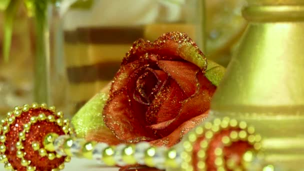 Red roses with gift box and candles on wooden background. — Stock Video