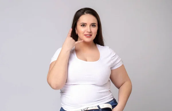 Plus Size Model with long hair Making Call Me Gesture — Stock Photo, Image