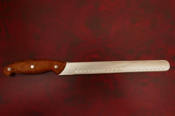 Cuchillo en una tabla de cortar —  Fotos de Stock