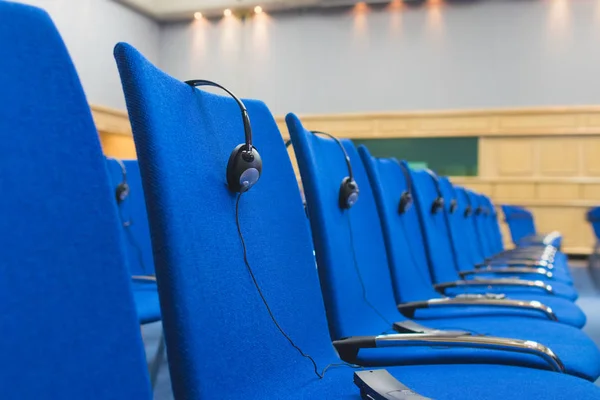 Headphones and  receivers on the chairs Royalty Free Stock Photos