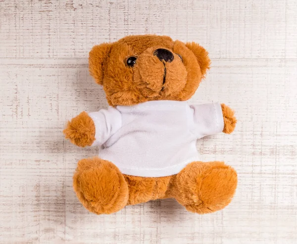 Teddy Bear toy alone on wood — Stock Photo, Image