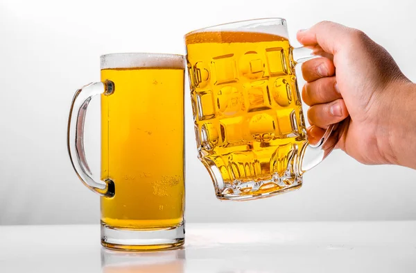 Two Mugs of fresh beer with cap foam — Stock Photo, Image