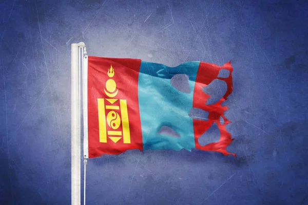 Torn flag of Mongolia flying against grunge background — Stock Photo, Image