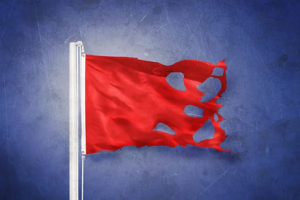 Torn Red flag flying against grunge background — Stock Photo, Image