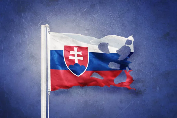 Torn flag of Slovakia flying against grunge background — Stock Photo, Image