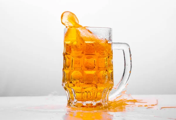 Glass of fresh beer on white background — Stock Photo, Image