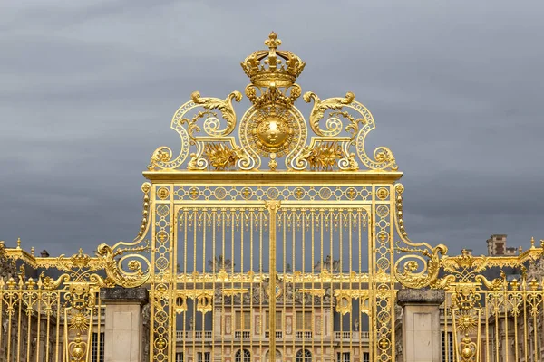 The golden gate of the Palace of Versailles, or Chateau de Versailles, or simply Versailles, in France Stock Photo