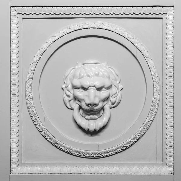 Lion head relief on the facade Stock Picture