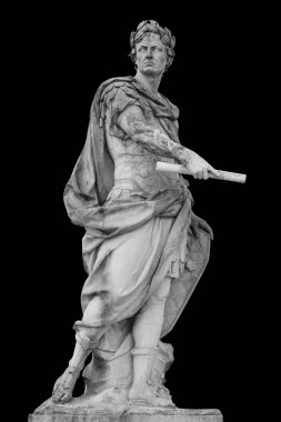 Roman emperor Julius Caesar statue isolated over black background clipart