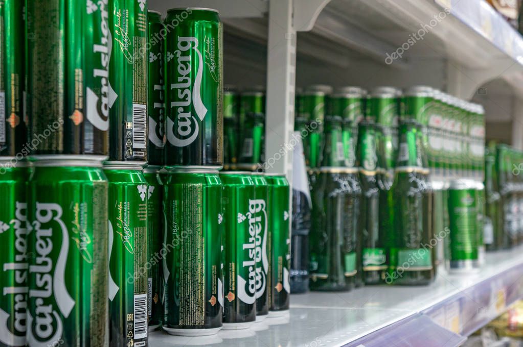 Moscow, Russia - March 12, 2018: Display with Carlsberg beer in cans in supermarket Lenta. One of largest retailer in Russia.