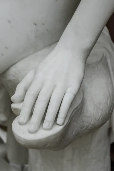 White antique marble stone statue detail of human hand — Stockfoto