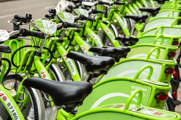 Budapest, Hungary - March 25, 2018: Public green bicycles to rent in the center of the Hungarian city. Bike-sharing. Ecological means of transport. Measure in the towns against air pollution. Bikes — Stock Photo, Image