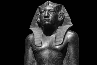 Pharaoh Egyptian gods dead religion symbol stone statue isolated on black. Stone pharaoh tutankhamen mask on black background clipart