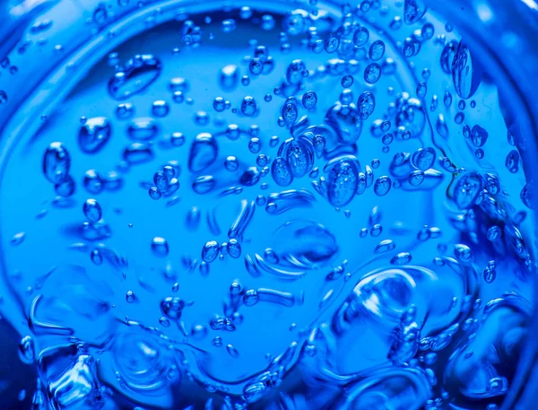 液体ブルーゲル泡。高分子ゲル。シリカゲル。青いハイドロゲルのボール。反射とクリスタル液体ボール。テクスチャの背景。マクロを閉じます。気泡のある石鹸の背景 ロイヤリティフリーのストック画像