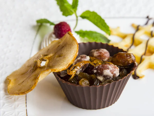 Chocolate basket with candied fruits and nuts — Stock Photo, Image