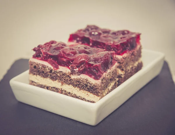 Chocolate cake with cherry jelly — Stock Photo, Image