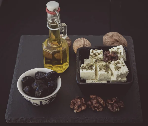 Cheese, olives and walnuts — Stock Photo, Image