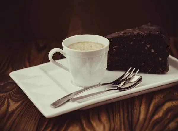 Slice of chocolate cake and coffee — Stock Photo, Image