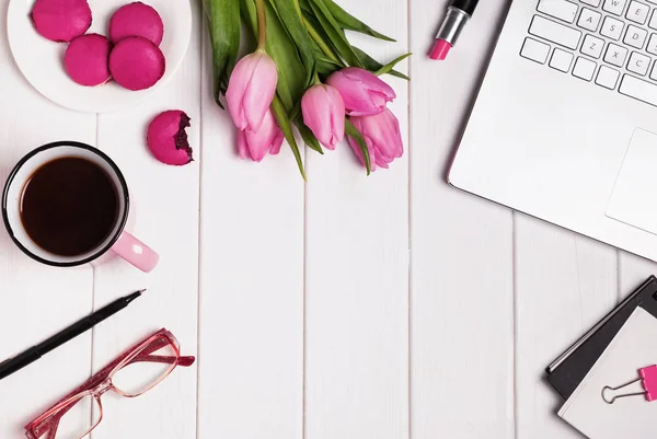 Computer, glasses, coffee and accessories in pink color on white — Stock Photo, Image