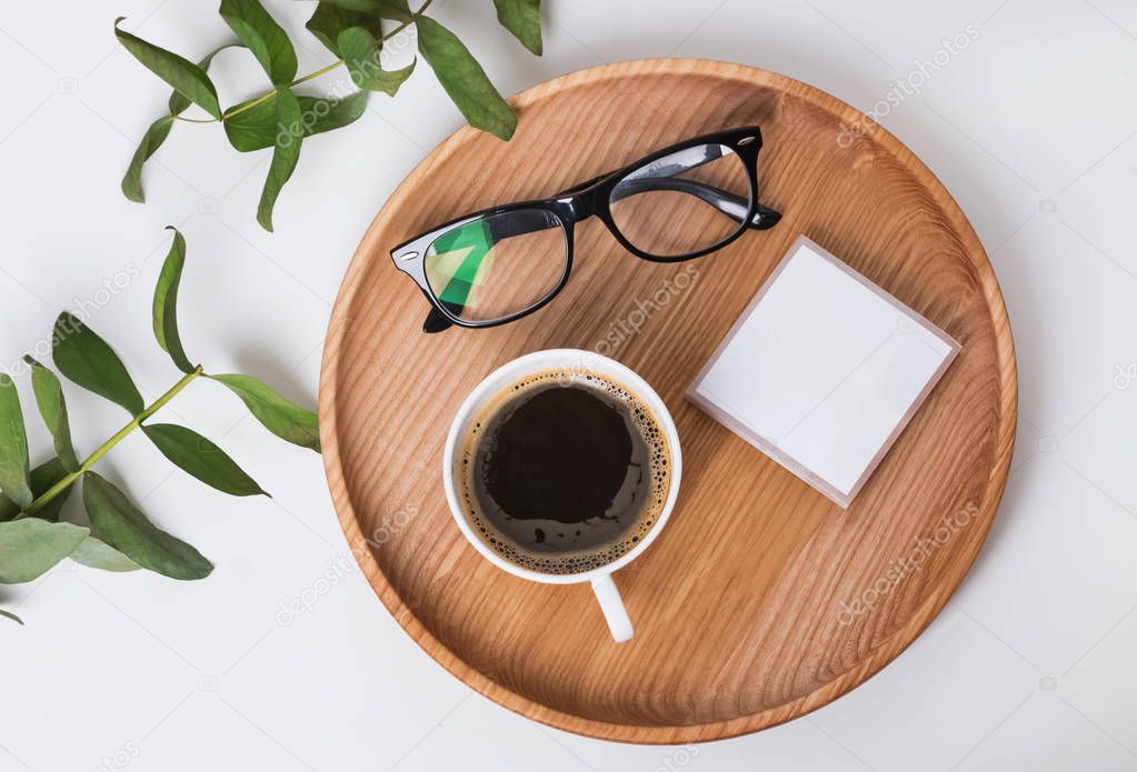 Coffee and glasses on the wooden tray