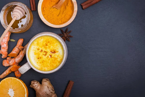 Healthy drink golden turmeric latte in a mug. — Stock Photo, Image