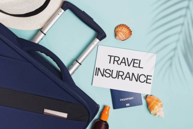 Items for summer vacationl flat lay. Travel insurrance.