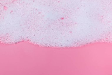 White foam on pink background