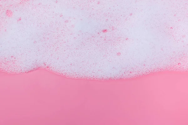 White foam on pink background — Stock Photo, Image