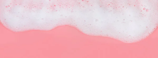 Schiuma di sapone bianco su sfondo rosa , — Foto Stock