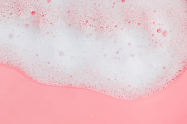 White soap foam on pink background — Stock Photo, Image