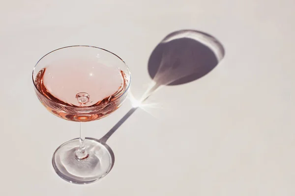 Glass of sparkling wine on the white table — Stock Photo, Image