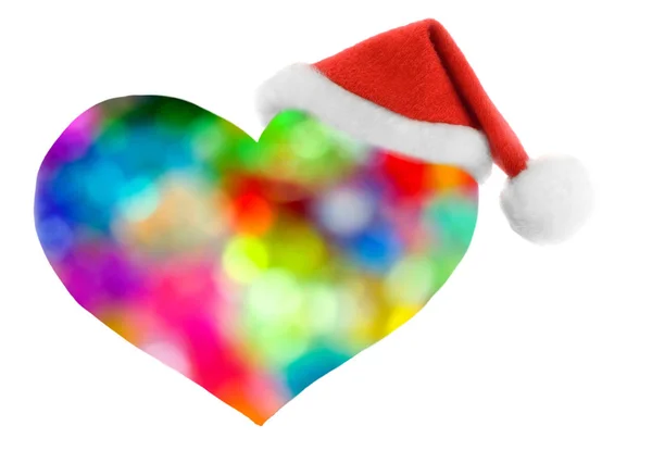 Chapéu de Papai Noel em férias desfocado coração decorativo — Fotografia de Stock